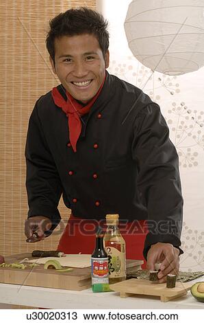 Asian chef preparing food View Large Photo Image Stock Image - Asian chef preparing food. Fotosearch