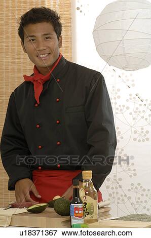 Stock Photo - Asian chef preparing food. Fotosearch