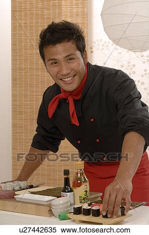 Stock Photography - Asian chef preparing food. Fotosearch