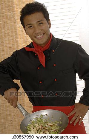Stock Image - Asian chef with Wok. Fotosearch