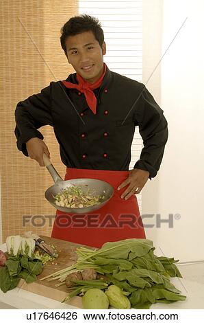 Stock Photograph - Asian chef with Wok. Fotosearch