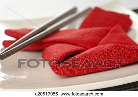 Stock Photography - Asian place setting with a red napkin and chopsticks. Fotosearch