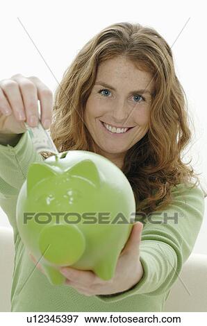 Stock Photo - Banknote for the piggybank. Fotosearch