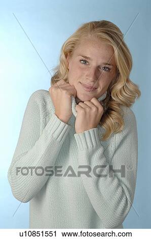 Blond teenage girl wearing pullover View Large Photo Image Stock Image - Blond teenage girl wearing pullover. Fotosearch