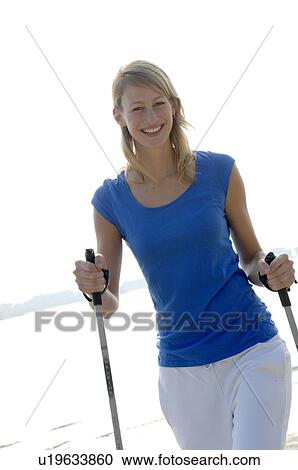 Stock Image - Blond woman walking. Fotosearch