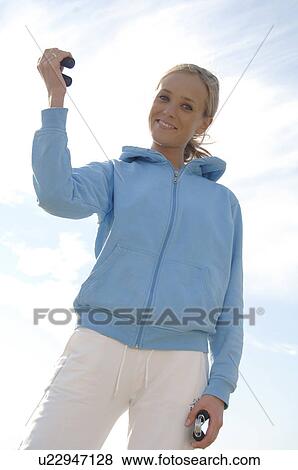 Stock Photo - Blonde woman with small handles. Fotosearch