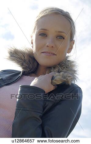 Stock Photo - Blonde woman with winter jacket. Fotosearch