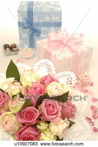 Stock Image - Blue and pink gift and a bouquet. Fotosearch