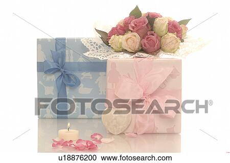 Blue and pink gift and a bouquet View Large Photo Image Stock Image - Blue and pink gift and a bouquet. Fotosearch