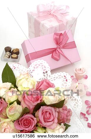 Blue and pink gift and a bouquet View Large Photo Image Stock Photograph - Blue and pink gift and a bouquet. Fotosearch