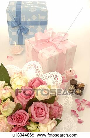 Stock Photography - Blue and pink gift and a bouquet. Fotosearch