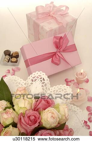 Stock Photography - Blue and pink gift and a bouquet. Fotosearch