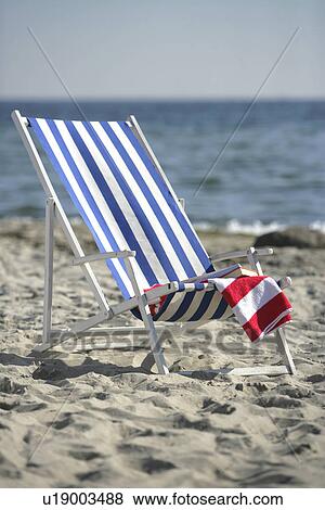 Blue and white deckchair on the beach View Large Photo Image Stock Photo - Blue and white deckchair on the beach. Fotosearch