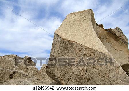 Stock Image - Boulder and sky. Fotosearch