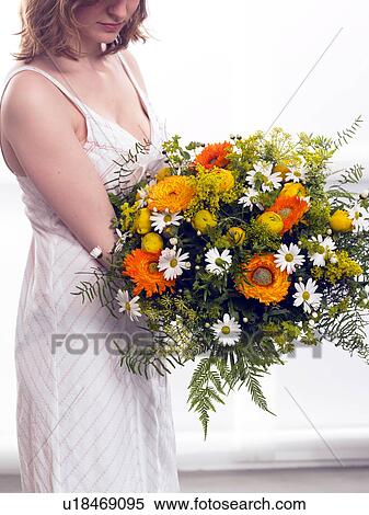 Stock Photography - Bouquet of marigold, buttercups and marguerites. Fotosearch