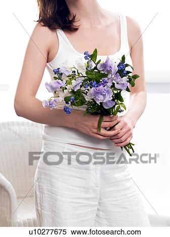 Stock Photography - Bouquet of vetches and forget-me-nots. Fotosearch
