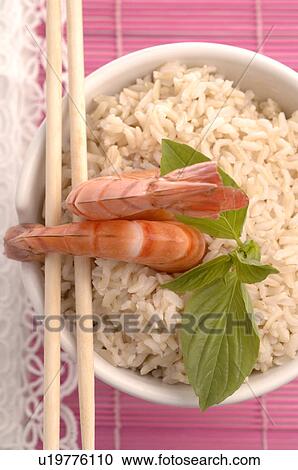 Bowl filled with rice and prawns on top View Large Photo Image Stock Image - Bowl filled with rice and prawns on top. Fotosearch