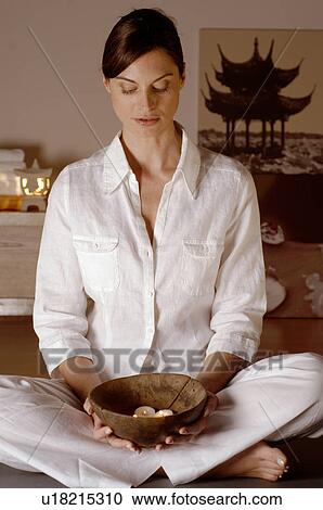Stock Image - Bowl with fragrance candles. Fotosearch