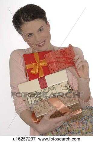 Brunette with a pile of presents View Large Photo Image Stock Photo - Brunette with a pile of presents. Fotosearch