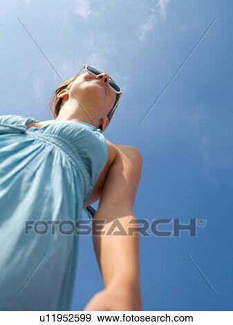 Brunette with sun glasses View Large Photo Image Stock Photo - Brunette with sun glasses. Fotosearch