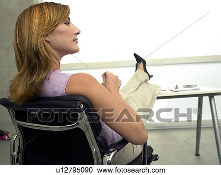 Business woman at her desk View Large Photo Image Stock Image - Business woman at her desk. Fotosearch