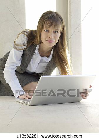 Business woman with portable View Large Photo Image Stock Image - Business woman with portable. Fotosearch