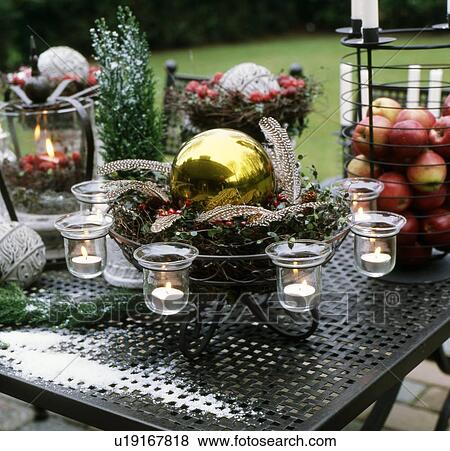 Stock Photo - Christmas decoration on table outdoors. Fotosearch