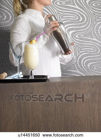 Cocktail bar and bar tender View Large Photo Image Stock Image - Cocktail bar and bar tender. Fotosearch