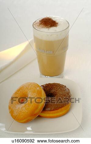 Stock Image - Coffee with milk with doughnuts. Fotosearch
