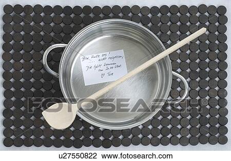Stock Image - Cooking pot with slip of paper. Fotosearch