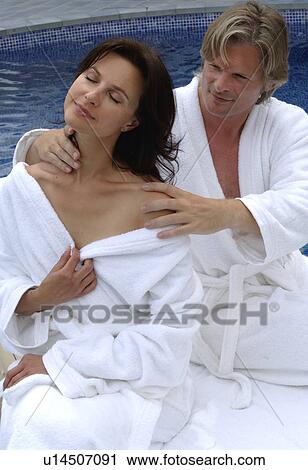Couple at the swimming pool - man is massaging woman View Large Photo Image Stock Image - Couple at the swimming pool - man is massaging woman. Fotosearch