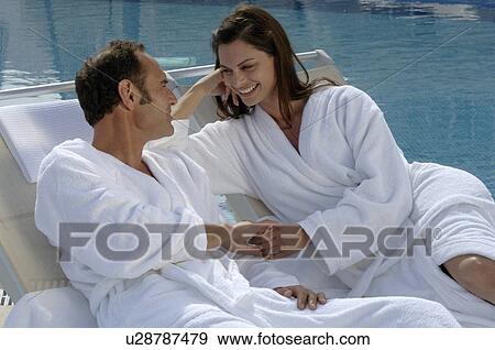 Stock Photo - Couple at the swimming pool. Fotosearch