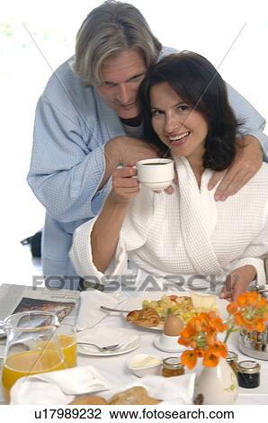 Stock Image - Couple is having breakfast. Fotosearch