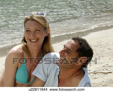 Couple on the beach View Large Photo Image Picture - Couple on the beach. Fotosearch
