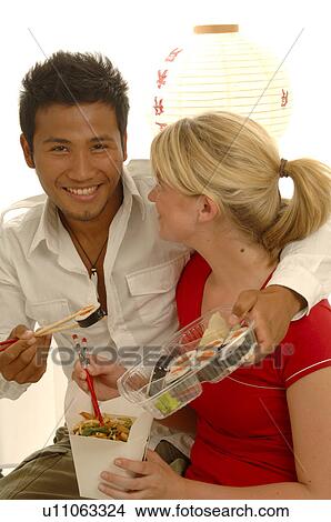 Couple with Asian food View Large Photo Image Picture - Couple with Asian food. Fotosearch