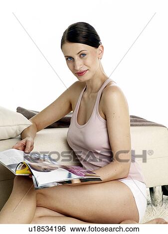 Dark-red haired woman in underwear sitting on the floor reading a magazine View Large Photo Image Stock Photograph - Dark-red haired woman in underwear sitting on the floor reading a magazine. Fotosearch