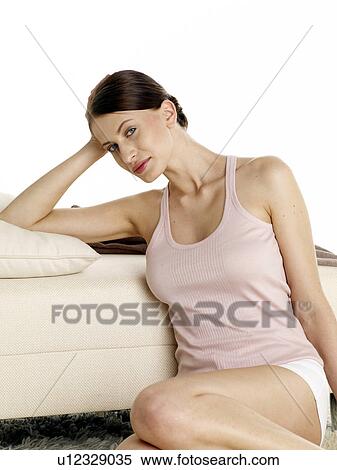 Dark-red haired woman in underwear sitting on the floor View Large Photo Image Stock Photography - Dark-red haired woman in underwear sitting on the floor. Fotosearch