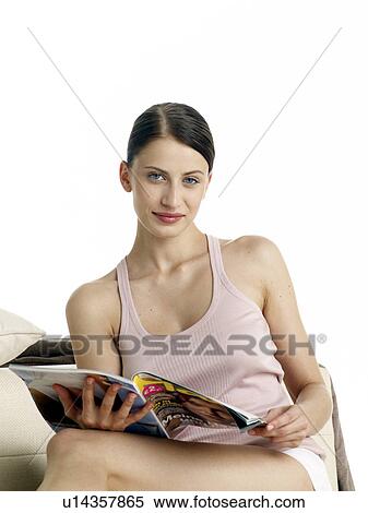 Dark-red haired woman in underwear sitting on the floor reading a magazine View Large Photo Image Stock Photography - Dark-red haired woman in underwear sitting on the floor reading a magazine. Fotosearch