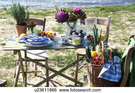 Stock Photograph - Decorated table at the seaside. Fotosearch