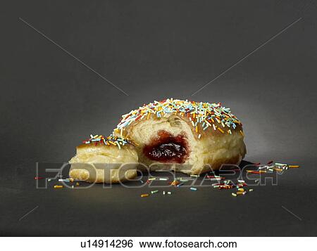 Stock Photograph - Donut with colourful streusel. Fotosearch