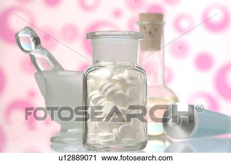 Stock Image - Dr. Schüssler's cell salts pills in a bottle. Fotosearch