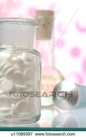 Stock Photo - Dr. Schüssler's cell salts pills in a bottle. Fotosearch