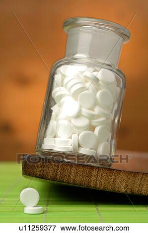 Stock Photo - Dr. Schüssler's cell salts pills in a bottle. Fotosearch