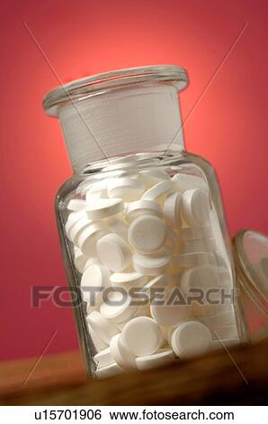 Stock Photograph - Dr. Schüssler's cell salts pills in a bottle. Fotosearch