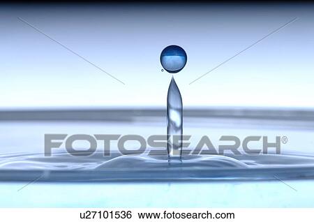 Stock Photograph - Drip of water dipping in the water surface. Fotosearch