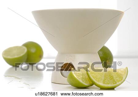 Stock Image - Duftlampe mit Limette. Fotosearch
