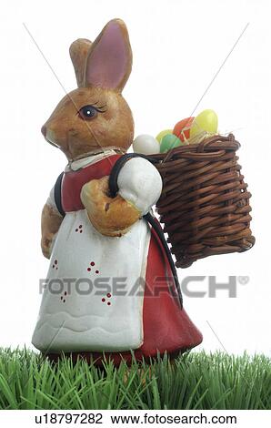 Stock Image - Easter bunny with basket. Fotosearch