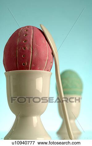 Easter eggs in white eggcups View Large Photo Image Stock Photo - Easter eggs in white eggcups. Fotosearch