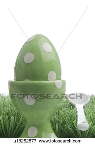 Stock Photo - Easter eggs in white eggcups. Fotosearch