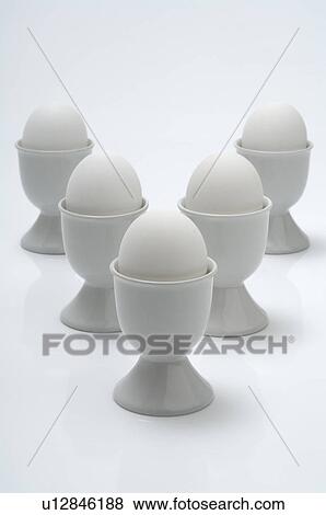 Stock Photo - Egg cups with eggs. Fotosearch